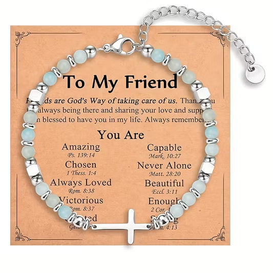 Bracelet with inspirational message on a card, featuring silver and light blue beads.